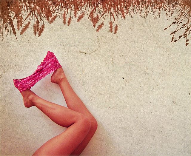 Legs and underwear on sand
